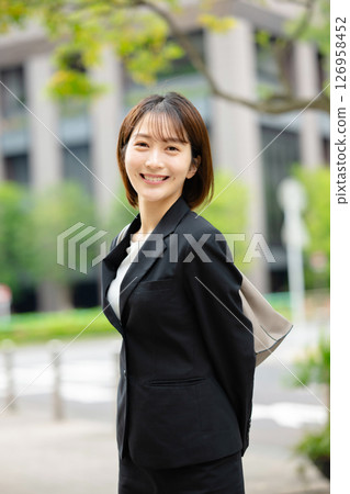 A woman in a suit 126958452