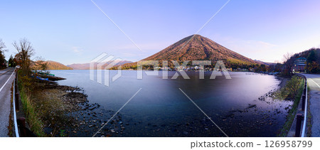 Panorama of Lake Chuzenji and Mt. Nantai, autumn leaves and dawn sky 126958799