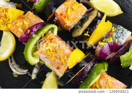Fresh raw salmon skewers, ready to cook. Fresh raw salmon skewers, ready to cook. 126958821