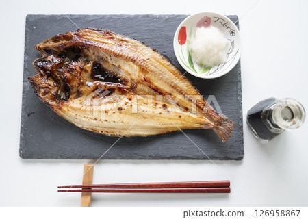 Grilled salted Atka mackerel with grated daikon radish Grilled salted Atka mackerel with grated daikon radish 126958867