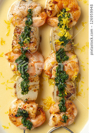 Portion of grilled shrimp skewers with sauce Portion of grilled shrimp skewers with sauce 126959948
