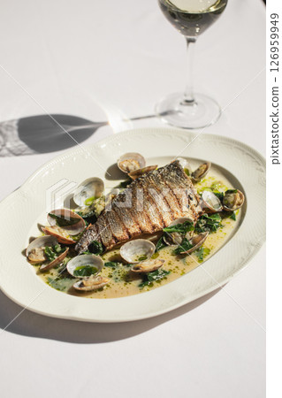 Portion of grilled mediterranean fish with mussels Portion of grilled mediterranean fish with mussels 126959949