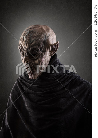 Portrait of a creepy monster over dark misty background Portrait of a creepy monster over dark misty background 126960476