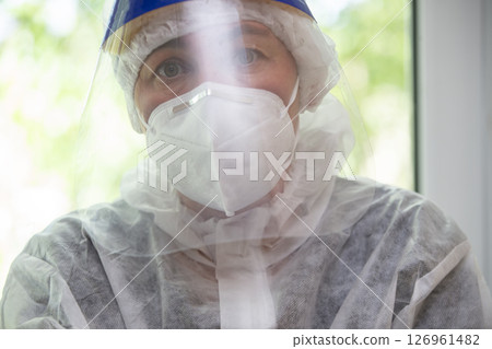 Doctor in a protective mask and suit for coronavirus infection. Doctor in a protective mask and suit for coronavirus infection. 126961482