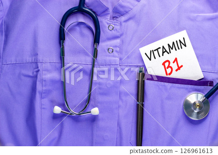Vitamin B1 symbol. Concept words Vitamin B1 on beautiful white card. Stethoscope and pen. Beautiful medical uniform. Medical healthy lifestyle Vitamin B1 concept. Vitamin B1 symbol. Concept words Vitamin B1 on beautiful white card. Stethoscope and pen. Beautiful medical uniform. Medical healthy lifestyle Vitamin B1 concept. 126961613