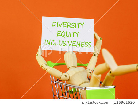 DEI diversity equity inclusiveness symbol. Concept words Diversity Equity Inclusiveness on white card. Beautiful orange background. Business DEI diversity equity inclusiveness concept. Copy space. 126961620