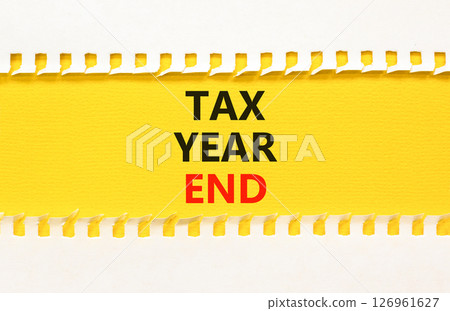 Tax year end symbol. Concept words Tax year end on beautiful yellow paper. Beautiful yellow white background. Business tax year end concept. Copy space. 126961627