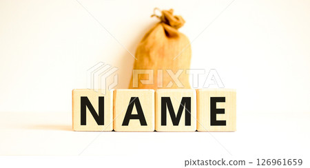 Name symbol. Concept word Name on beautiful wooden blocks. Beautiful canvas bag. Beautiful white table white background. Business, lifestyle, support and name concept. Copy space. 126961659