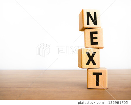 Next symbol. Concept word Next on beautiful wooden blocks. Beautiful wooden table white background. Business, lifestyle, support and next concept. Copy space. 126961705