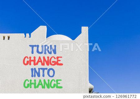 Turn change into chance symbol. Concept words phrase Turn change into chance on beautiful white wall. Beautiful white wall and blue sky background. Business Turn change into chance concept. Copy space Turn change into chance symbol. Concept words phrase Turn change into chance on beautiful white wall. Beautiful white wall and blue sky background. Business Turn change into chance concept. Copy space 126961772