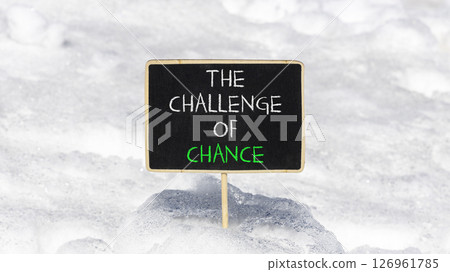 The challenge of chance symbol. Concept words phrase The challenge of chance on beautiful black blackboard. Beautiful white snow background. Business The challenge of chance concept. Copy space. The challenge of chance symbol. Concept words phrase The challenge of chance on beautiful black blackboard. Beautiful white snow background. Business The challenge of chance concept. Copy space. 126961785