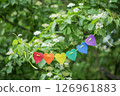 Rainbow Hearts LGBT. Colorful Paper Heart Garland Hanging Outdoors in Spring. Pride Month. Love, human rights, tolerance 126961883