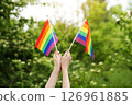 Teenager Holds Two Rainbow Flag LGBT in his Hands. Pride Month. Lesbian Gay Bisexual Transgender. Love, human rights, tolerance 126961885