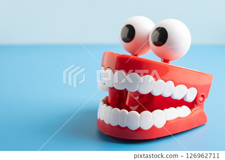 Tooth funny toy denture red color jaw and eye. Tooth funny toy denture red color jaw and eye. 126962711