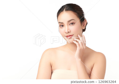 A beautiful young Asian woman with clean, fresh skin against a white background. Skincare, facial treatment, cosmetology, beauty, and spa. An elegant portrait of an Asian woman. A beautiful young Asian woman with clean, fresh skin against a white background. Skincare, facial treatment, cosmetology, beauty, and spa. An elegant portrait of an Asian woman. 126963264
