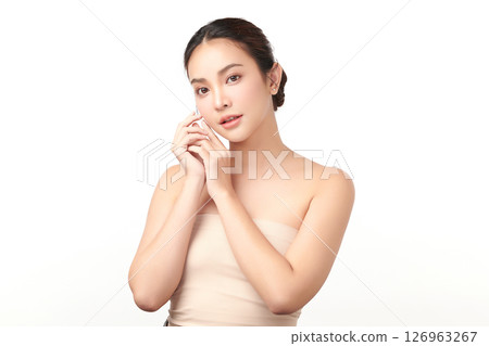 A beautiful young Asian woman with clean, fresh skin against a white background. Skincare, facial treatment, cosmetology, beauty, and spa. An elegant portrait of an Asian woman. A beautiful young Asian woman with clean, fresh skin against a white background. Skincare, facial treatment, cosmetology, beauty, and spa. An elegant portrait of an Asian woman. 126963267