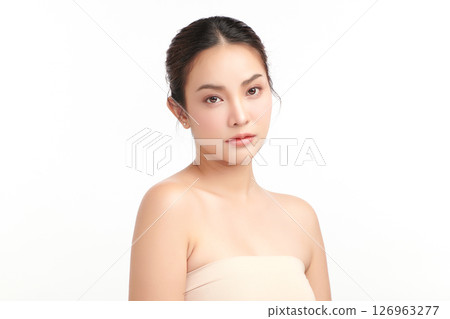 A beautiful young Asian woman with clean, fresh skin against a white background. Skincare, facial treatment, cosmetology, beauty, and spa. An elegant portrait of an Asian woman. A beautiful young Asian woman with clean, fresh skin against a white background. Skincare, facial treatment, cosmetology, beauty, and spa. An elegant portrait of an Asian woman. 126963277