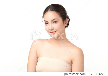 A beautiful young Asian woman with clean, fresh skin against a white background. Skincare, facial treatment, cosmetology, beauty, and spa. An elegant portrait of an Asian woman. A beautiful young Asian woman with clean, fresh skin against a white background. Skincare, facial treatment, cosmetology, beauty, and spa. An elegant portrait of an Asian woman. 126963278