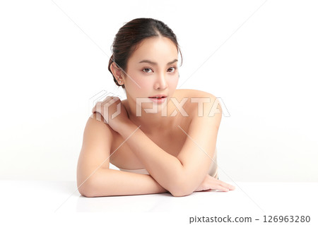 A beautiful young Asian woman with clean, fresh skin against a white background. Skincare, facial treatment, cosmetology, beauty, and spa. An elegant portrait of an Asian woman. A beautiful young Asian woman with clean, fresh skin against a white background. Skincare, facial treatment, cosmetology, beauty, and spa. An elegant portrait of an Asian woman. 126963280