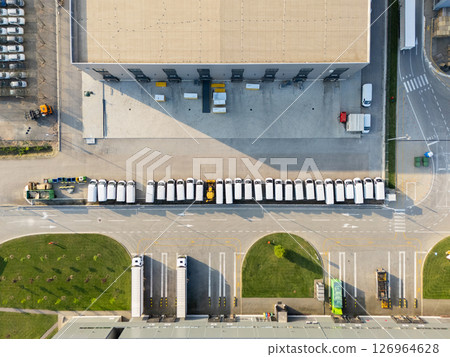 Aerial view of a new delivery vans parking lot at a logistics hub 126964628