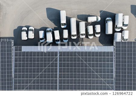 Delivery vans and trucks hub with solar panels on a roof. Fleet of vehicles 126964722