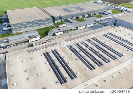 Logistics centers with solar panels on roofs. Aerial view Logistics centers with solar panels on roofs. Aerial view 126964726