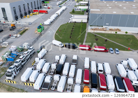 Aerial view of a new delivery vans parking lot at a logistics hub Aerial view of a new delivery vans parking lot at a logistics hub 126964728