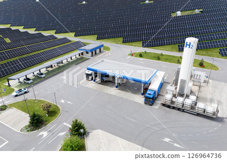 Hydrogen fuel station with fueling trucks and solar canopy with charging station for electric vehicles. 126964736