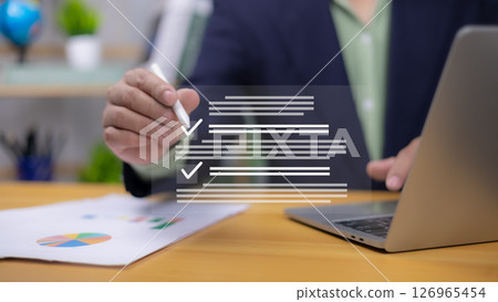 Hand with pen interacting with digital checklist. Symbolizes data entry, task completion, online forms, and business reporting. Ideal for productivity, compliance, analysis, efficient management now. Hand with pen interacting with digital checklist. Symbolizes data entry, task completion, online forms, and business reporting. Ideal for productivity, compliance, analysis, efficient management now. 126965454