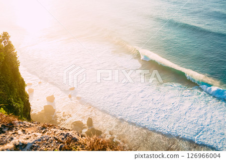 Ocean landscape with waves and rocks and sunshine Ocean landscape with waves and rocks and sunshine 126966004