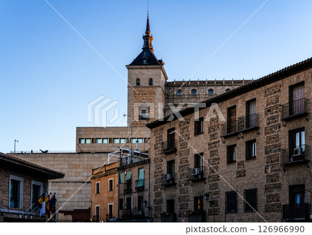 The majestic Alcazar of Toledo stands tall against a clear blue sky, showcasing its architectural grandeur. 126966990
