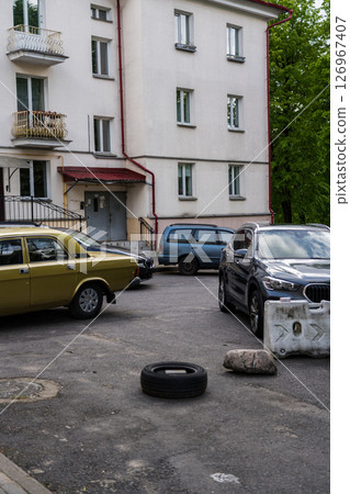 The old courtyard in Osmolovka district, Minsk. Parked cars The old courtyard in Osmolovka district, Minsk. Parked cars 126967407