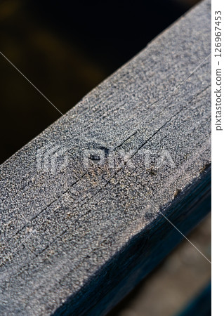 Frost on wooden railings, fences. Frost. Macro. Diagonal lines Frost on wooden railings, fences. Frost. Macro. Diagonal lines 126967453