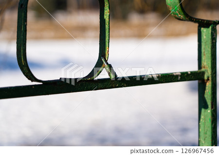 Iron, old handrails with a lock on them. Love lock on the railing 126967456