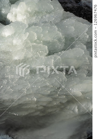 The ice is close. Background ice. Frozen waterfall in February morning The ice is close. Background ice. Frozen waterfall in February morning 126967476