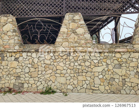 The stone walls are made of shell blocks. Traditional old stone fence 126967513