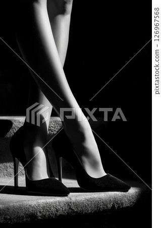 Porcelain doll delicate beauty highlighted in soft lighting with lifelike expression 126967568