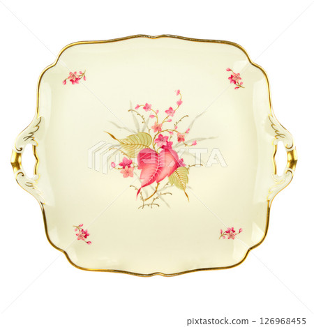 Vintage plate of unusual shape with gold rim isolated on white. Vintage plate of unusual shape with gold rim isolated on white. 126968455