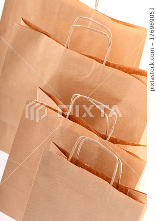 Shopping brown gift bags background 126969051