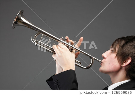Portrait of a young man playing his Trumpet 126969086