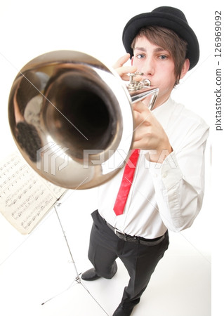 Portrait of a young man playing his Trumpet 126969092