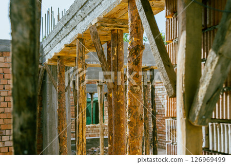 construction residential new house in progress at building site. High quality photo 126969499