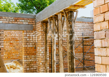 construction residential new house in progress at building site. High quality photo 126969500