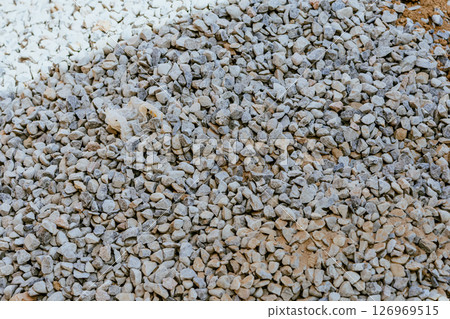 Crushed rock. Small rocks ground. Crushed stone road building material gravel texture. Small stone construction aggregate materi rock. Garden gravel background stone landscaping. Driveway gravel road 126969515
