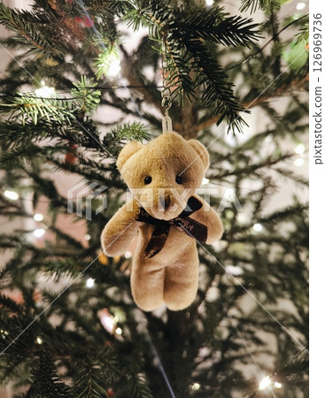 golden teddy bear ornament on christmas tree. Teddy bear ornament. golden teddy bear ornament on christmas tree. Teddy bear ornament. 126969736