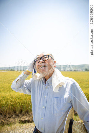 Heat stroke, agriculture, senior Japanese man suffering from heat Heat stroke, agriculture, senior Japanese man suffering from heat 126969803