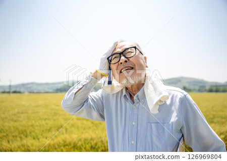 Heat stroke, agriculture, senior Japanese man suffering from heat Heat stroke, agriculture, senior Japanese man suffering from heat 126969804