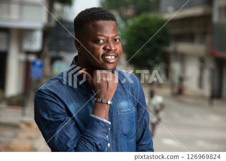 smiling man lost in positive thinking. 126969824