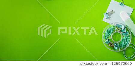Wide banner with minimalist design of school supplies in brightgreen background 126970600