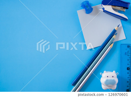 Superior view of didactic elements arranged on a plain light blue background .Copy sapce. 126970601